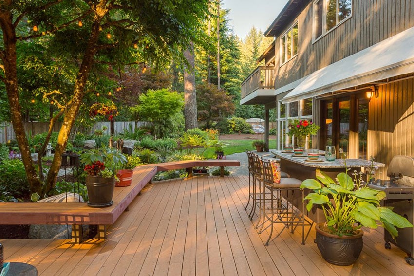 Deck next to garden with outdoor bar